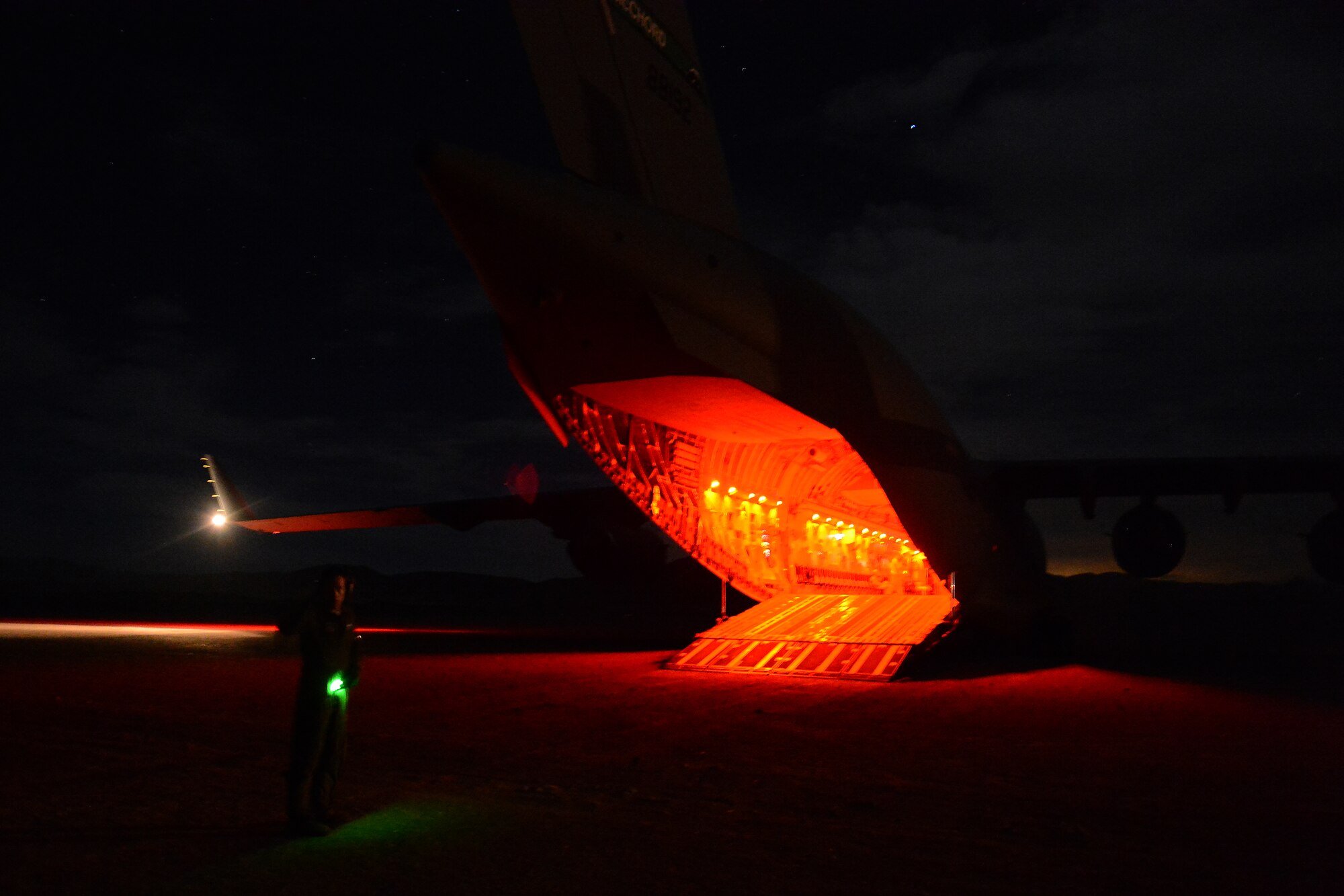 Staff Sgt. Andrew Wagner (right), 7th Airlift Squadron loadmaster, unloads a Stryker from the 7th Infantry Division Aug. 6, 2015, at the National Training Center, Calif., during a Joint Operation Access Exercise . The NTC mission is to provide realistic joint and combine arms training for units at the battalion and brigade levels. (U.S. Air Force photo\ Staff Sgt. Tim Chacon)
