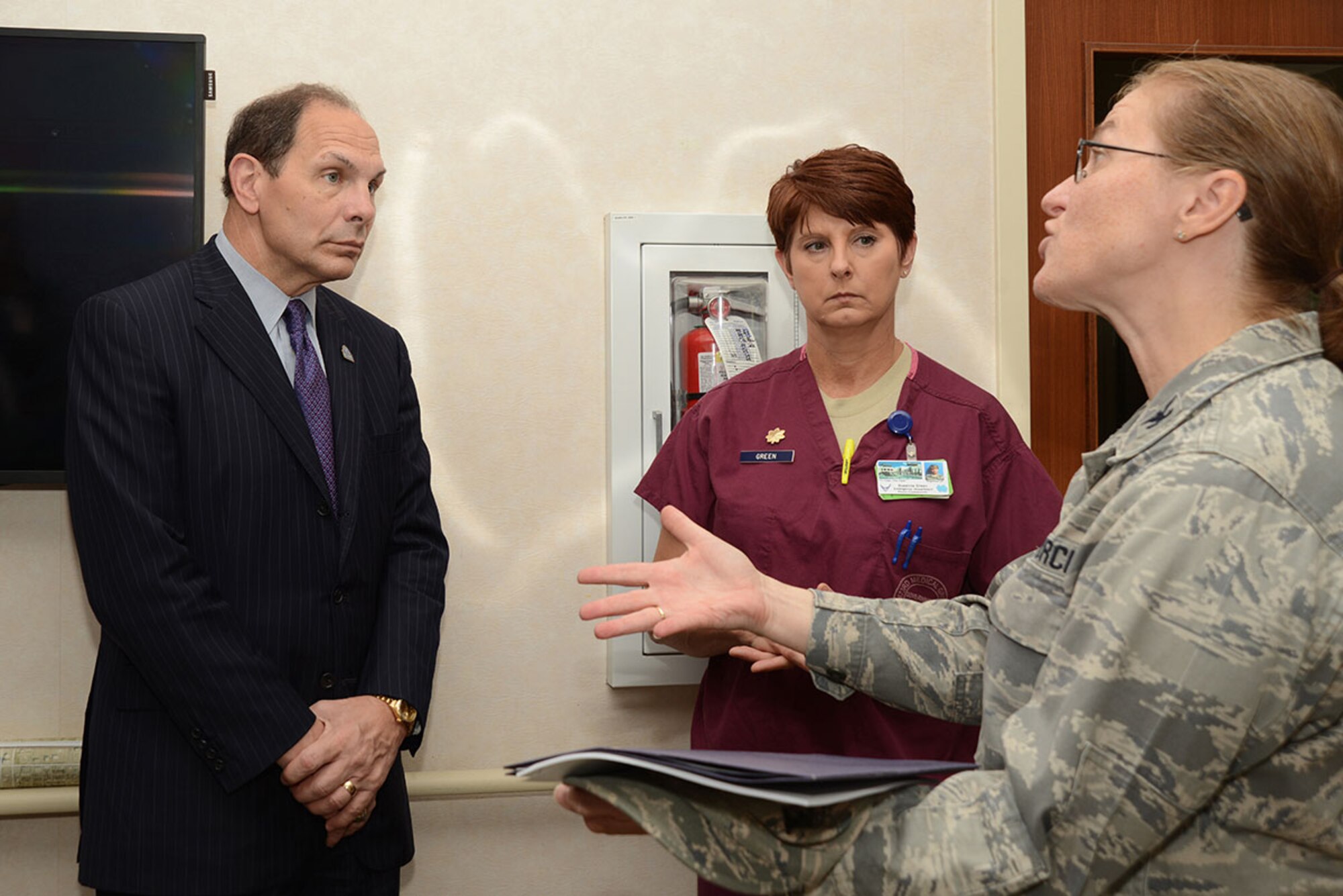 Air Force Col. Teresa Bisnett, 673d Medical Group commander, and Air Force Maj. Suzanne Green, 673d Medical Group Emergency Department Flight commander, speak with Robert McDonald, Secretary of Veterans Affairs, as part of a tour around the Joint Base Elmendorf-Richardson hospital Aug. 11. (U.S. Air Force photo/Airman Christopher R. Morales)