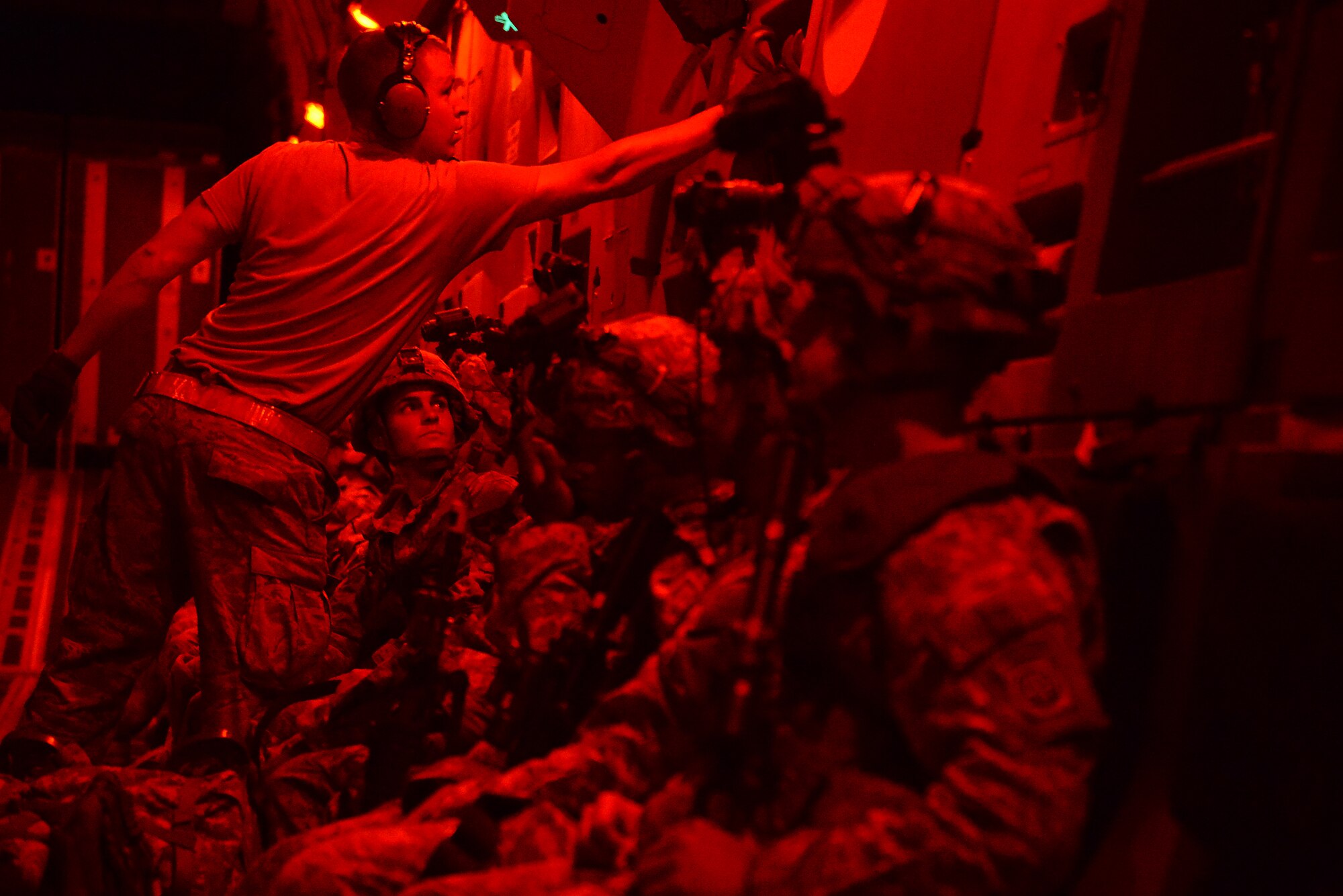 Airmen from the 62nd Airlift Wing prepare to deliver Soldiers from the 82nd Airborne Division and 7th Infantry Division Aug. 6, 2015, to the National Training Center, Calif., during a Joint Operation Access Exercise. The 62nd AW delivered the solders via air land operations on an airstrip paratroopers from the 82nd AD simulated taking over from a simulated enemy force.  (U.S. Air Force photo\ Staff Sgt. Tim Chacon)