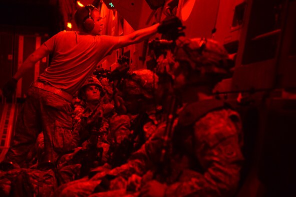 Airmen from the 62nd Airlift Wing prepare to deliver Soldiers from the 82nd Airborne Division and 7th Infantry Division Aug. 6, 2015, to the National Training Center, Calif., during a Joint Operation Access Exercise. The 62nd AW delivered the solders via air land operations on an airstrip paratroopers from the 82nd AD simulated taking over from a simulated enemy force.  (U.S. Air Force photo\ Staff Sgt. Tim Chacon)