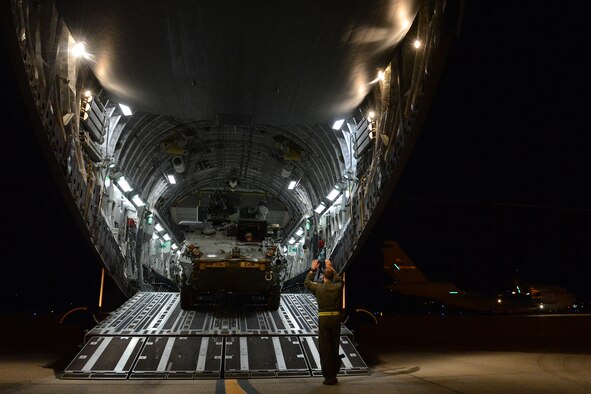 Staff Sgt. Andrew Wagner (right), 7th Airlift Squadron loadmaster, loads a Stryker from the 7th Infantry Division into a C-17 Aug. 6, 2015, at March Air Reserve Base, Calif., during a Joint Operation Access Exercise. The Strykers where loaded into the C-17 after to be air land delivered to the National Training Center at Fort Irwin, Calif. (U.S. Air Force photo\ Staff Sgt. Tim Chacon)