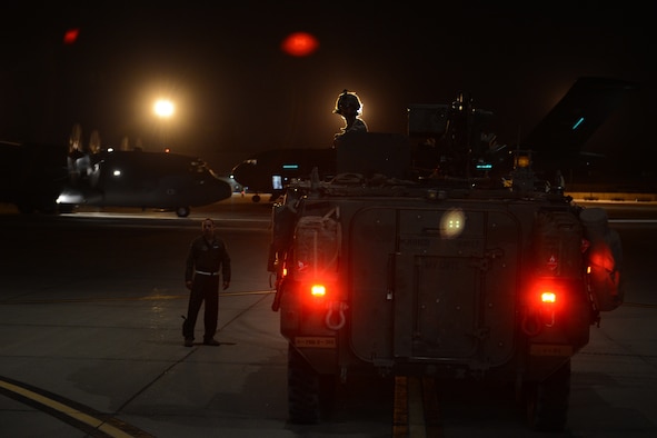 A Stryker from the 7th Infantry Division backs into a C-17 Globemaster III Aug. 6, 2015, at March Air Reserve Base Calif., during a Joint Operation Access Exercise. A total of six Strykers were delivered by two C-17s during the exercise via air land operations, at night to the National Training Center at Fort Irwin, Calif. (U.S. Air Force photo\ Staff Sgt. Tim Chacon)