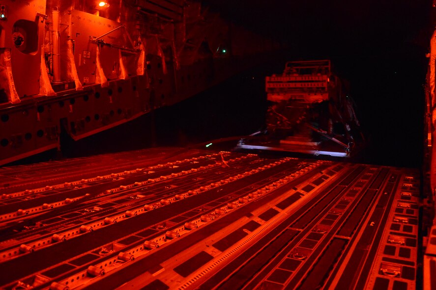 An Army light all-terrain vehicle is air dropped from a 62nd Airlift Wing C-17 Globe Master III Aug. 6, 2015, to the National Training Center at Fort Irwin, Calif., during a Joint Operation Access Exercise .The 62nd AW dropped more than 190,000 pounds of the total 328,00 pounds of cargo dropped during the exercise. (U.S. Air Force photo\ Staff Sgt. Tim Chacon)