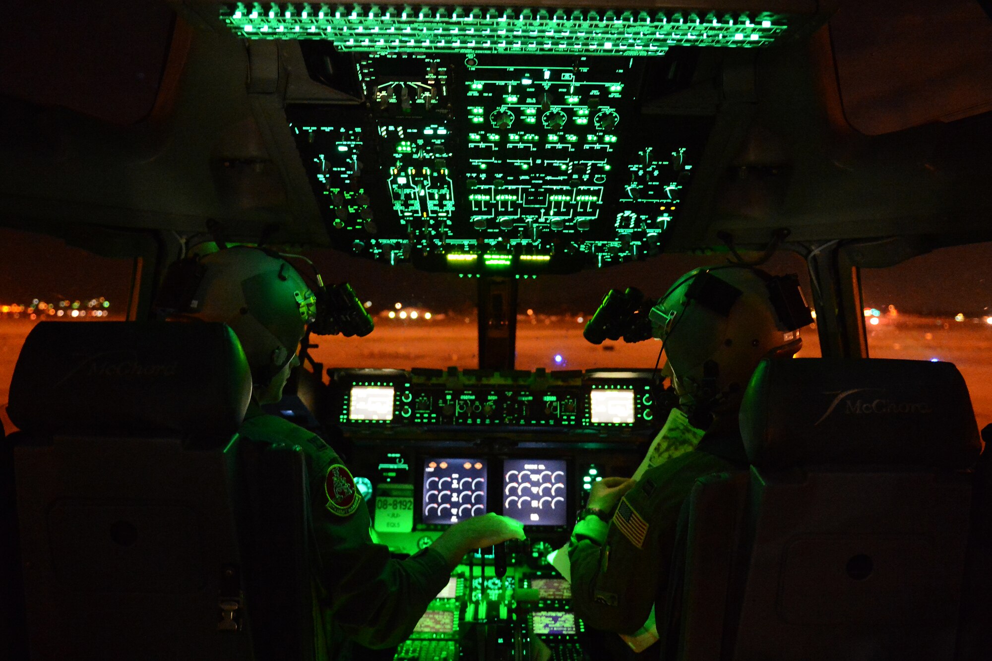 Capt. Chris Wojowicz, (left) and Capt. Travis Delzer, 10th Airlift Squadron pilots, prepare for takeoff Aug. 6, 2015, at March Air Reserve Base, Calif., during a Joint Operation Access Exercise. The premises of the exercise was for the Air Force to parachute Soldiers from the 82nd Airborne Division onto an airstrip that they would seize and take control of . (U.S. Air Force photo\ Staff Sgt. Tim Chacon)