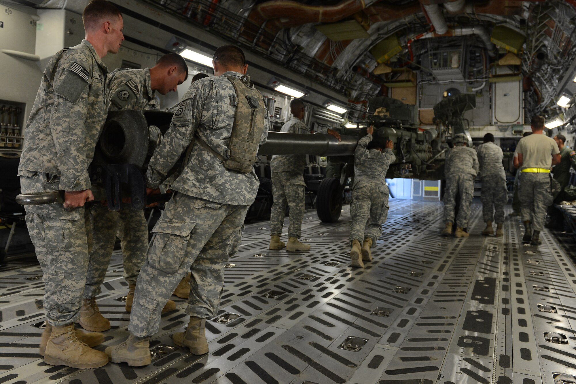 Soldiers from the 82nd Airborne Division load a High-Mobility Rocket System onto a C-17 Globemaster III Aug. 4, 2015, at March Air Reserve Base for a Joint Operation Access Exercise. The HiMARS was delivered to National Training Center, Fort. Irwin, Calif., utilizing Semi Prepared Runway Operations landing. (U.S. Air Force photo\ Staff Sgt. Tim Chacon)