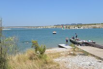The water-break line located at the Laughlin Southwinds Marina was moved further out to protect the dock and boats anchored to it.  If water levels were to decrease again in Lake Amistad, the dock would be able to attach to the boat launch ramp dock. This would allow the marina to still provide gas sales, wet slips and boat rentals.  (U.S. Air Force photo by 2nd Lt Jhanelle Haag)
