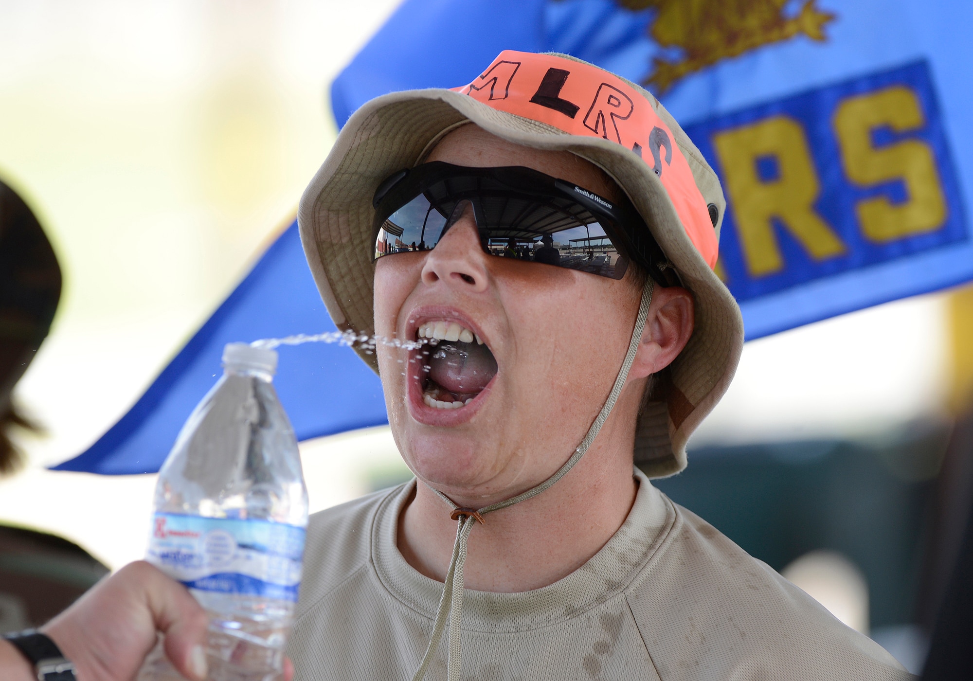 Senior Master Sgt. Shannon Woods, 138th Logistics Readiness Squadron, receives some hydration during the 138th Fighter Wing's combat dining-in held Aug. 1, 2015 at the Tulsa Air National Guard base.  The wing's senior non-commissioned officer’s council sponsored the event as a way to enhance camaraderie and promote esprit de corps throughout the ranks.   (U.S. National Guard photo by Master Sgt. Mark A. Moore/Released)