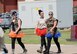 Senior Airman Erin Crews (left), Airman 1st Class Natasha Applegate (center) and Master Sgt. Christine Cook (right) survey the festivities as they prepare to enter the 138th Fighter Wing's combat dining-in held Aug. 1, 2015 at the Tulsa Air National Guard base.  The wing's senior non-commissioned officer's council sponsored the event as a way to enhance camaraderie and promote esprit de corps throughout the ranks.   (U.S. National Guard photo by Master Sgt. Mark A. Moore/Released)