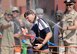 Col. David Burgy, 138th Fighter Wing Commander, gets soaked with water as he completes the obstacle course during the 138th Fighter Wing's combat dining-in held Aug. 1, 2015 at the Tulsa Air National Guard base.  The wing's senior non-commissioned officer's council sponsored the event as a way to enhance camaraderie and promote esprit de corps throughout the ranks.   (U.S. National Guard photo by Master Sgt. Mark A. Moore/Released)