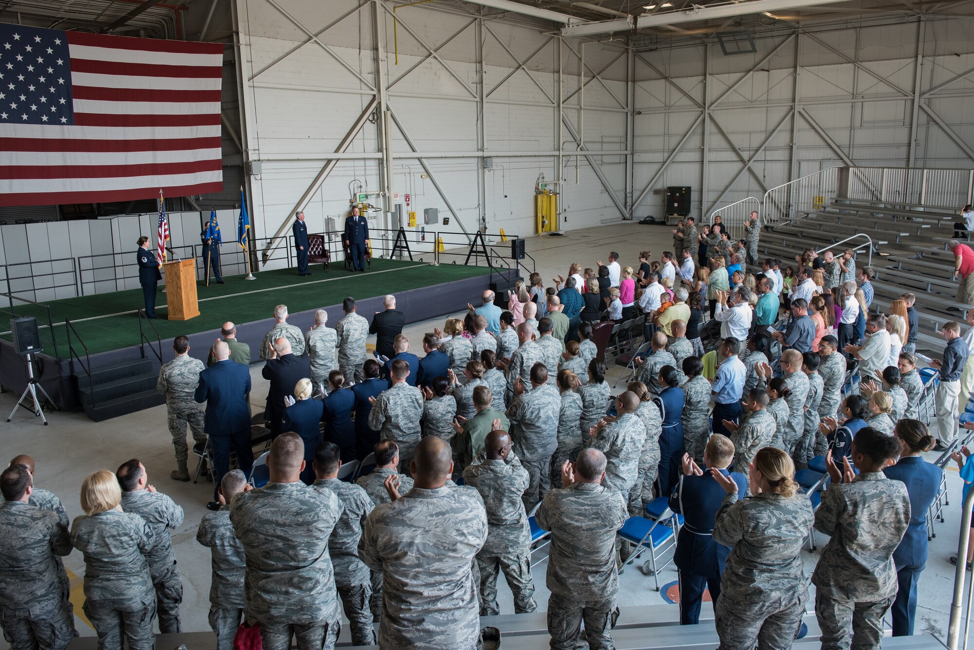 Lt. Col. Ralph Baker, 940th Aerospace Medicine Squadron commander receives a standing ovation during a ceremony where he assumed command of the squadron from Col. John Trnka, Jr., 940th Wing commander Aug. 2, 2015 at Dock 6, Beale Air Force Base, Calif. The ceremony is a military tradition that represents the formal transfer of authority and responsibility from one commander to another. (U.S. Air Force photo by Staff Sgt. Brenda Davis/Released)