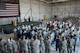 Lt. Col. Ralph Baker, 940th Aerospace Medicine Squadron commander receives a standing ovation during a ceremony where he assumed command of the squadron from Col. John Trnka, Jr., 940th Wing commander Aug. 2, 2015 at Dock 6, Beale Air Force Base, Calif. The ceremony is a military tradition that represents the formal transfer of authority and responsibility from one commander to another. (U.S. Air Force photo by Staff Sgt. Brenda Davis/Released)