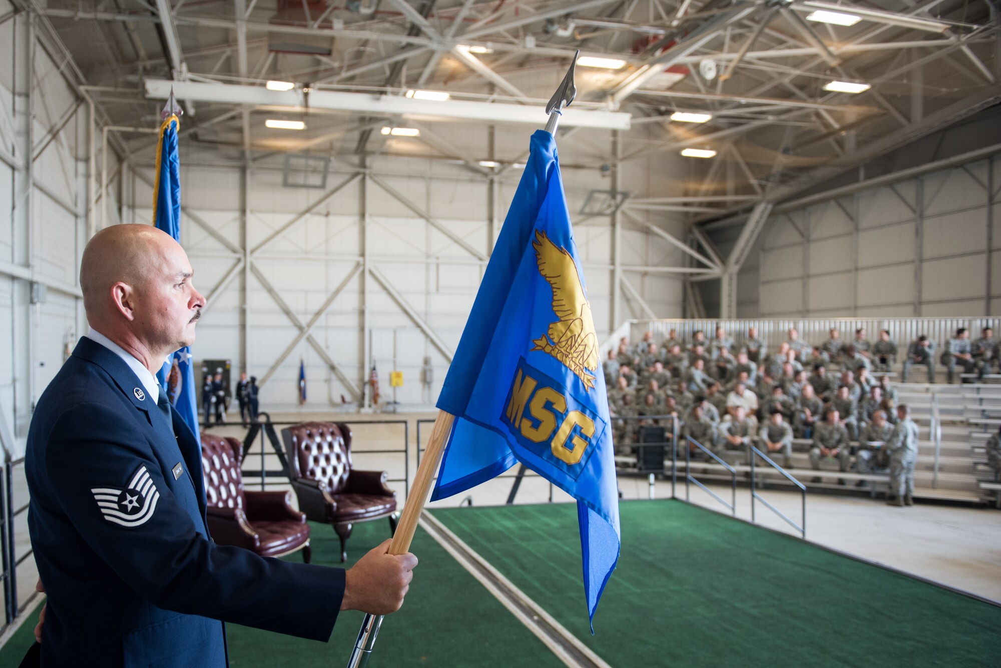 Technical Sgt. Peter Thompson holds the guide in anticipation of the ceremony where Col. Roderick T. Grunwald assumes command of the 940th Mission Support Group from Col. John Trnka, Jr., 940th Wing commander. The ceremony is a military tradition that represents the formal transfer of authority and responsibility from one commander to another. (U.S. Air Force photo by Staff Sgt. Brenda Davis/Released)