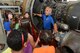 HANSCOM FIELD, Mass.  – Sam Rath, Community Relations Manager, National Aviation Academy, describes a jet engine to students from Hanscom Air Force Base’s STARBASE Academy during a tour of Hanscom Field, Aug. 12, 2015. The tour was part of STARBASE Academy's five-day Flight Week program, which featured flight-themed activities; including computer-aided, design-based projects and visits to nearby aviation venues. (U.S. Air Force photo by Jerry Saslav)