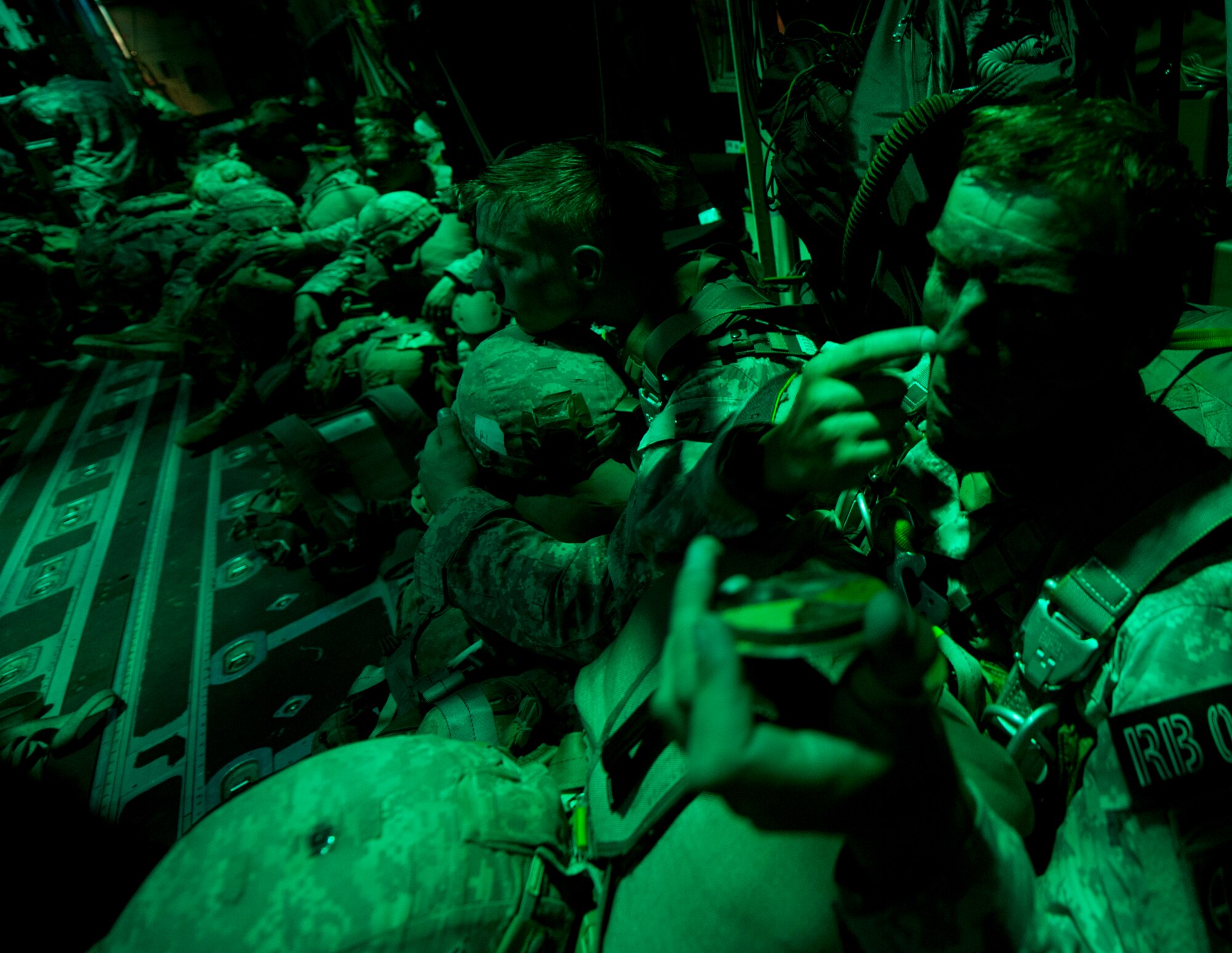 A jumpmaster from the Army’s 2nd Brigade Combat Team, 82nd Airborne Division, dons camo face paint prior to a jump Aug. 6, 2015, near March Air Reserve Base, Calif. The 41st Airlift Squadron along with the 61st Airlift Squadron provided C-130J Combat Airlift for the troops and heavy equipment during Operation Dragon Spear. (U.S. Air Force photo by Senior Airman Scott Poe)