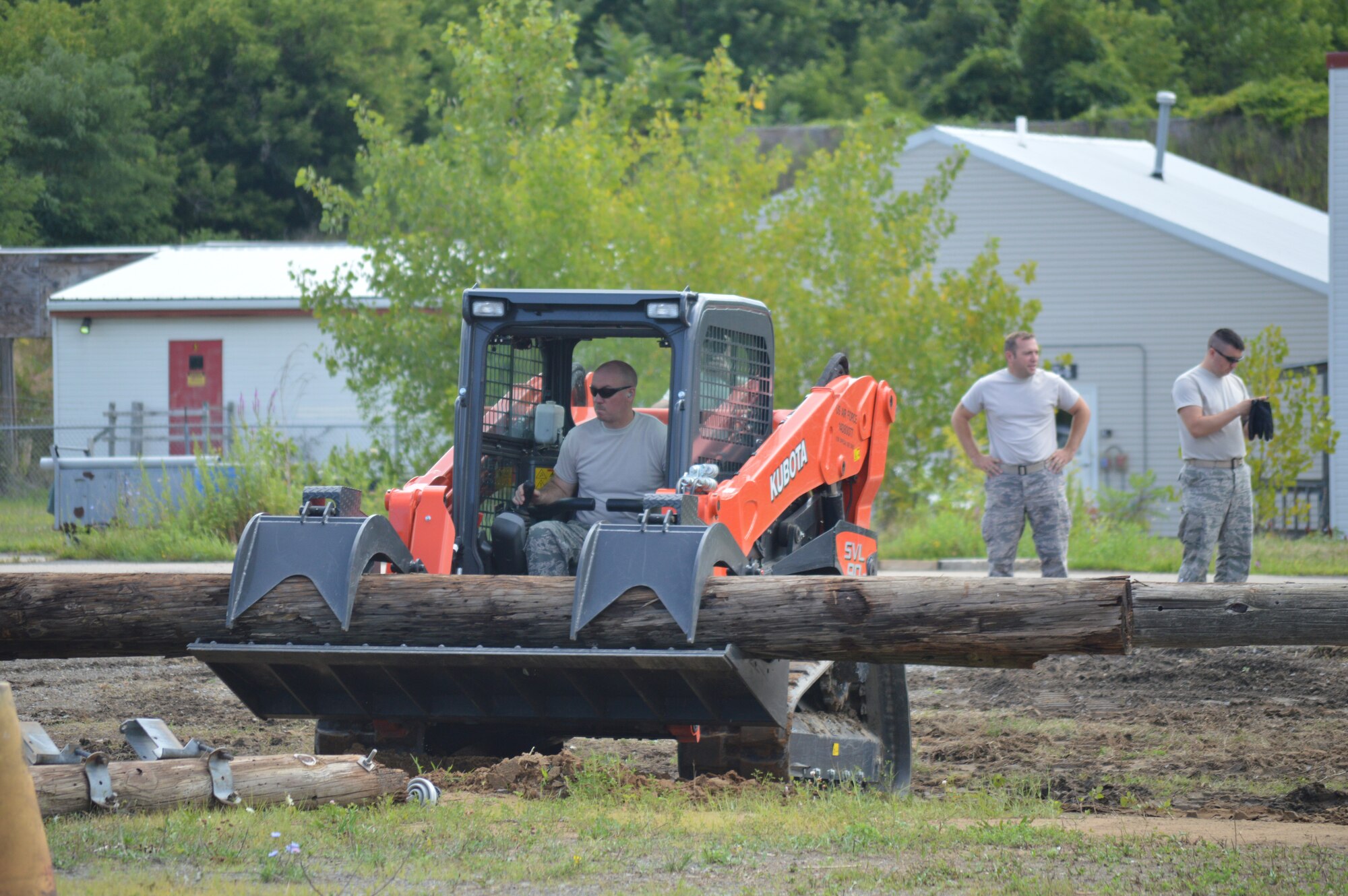 Tech. Sgt. Brian Kissinger, a firefighter with the 109th Airlift Wing, operates a skid steer during training Aug. 12, 2015 at Stratton Air National Guard Base, New  York. The skid steers are part of the equipment package the 109th AW received as part of the debris clearance package to support domestic operations. The 109th Logistic Readiness Squadron's Vehicle Maintenance Flight has been training members throughout the base on the equipment received. (U.S. Air National Guard photo by Tech. Sgt. Catharine Schmidt/Released)