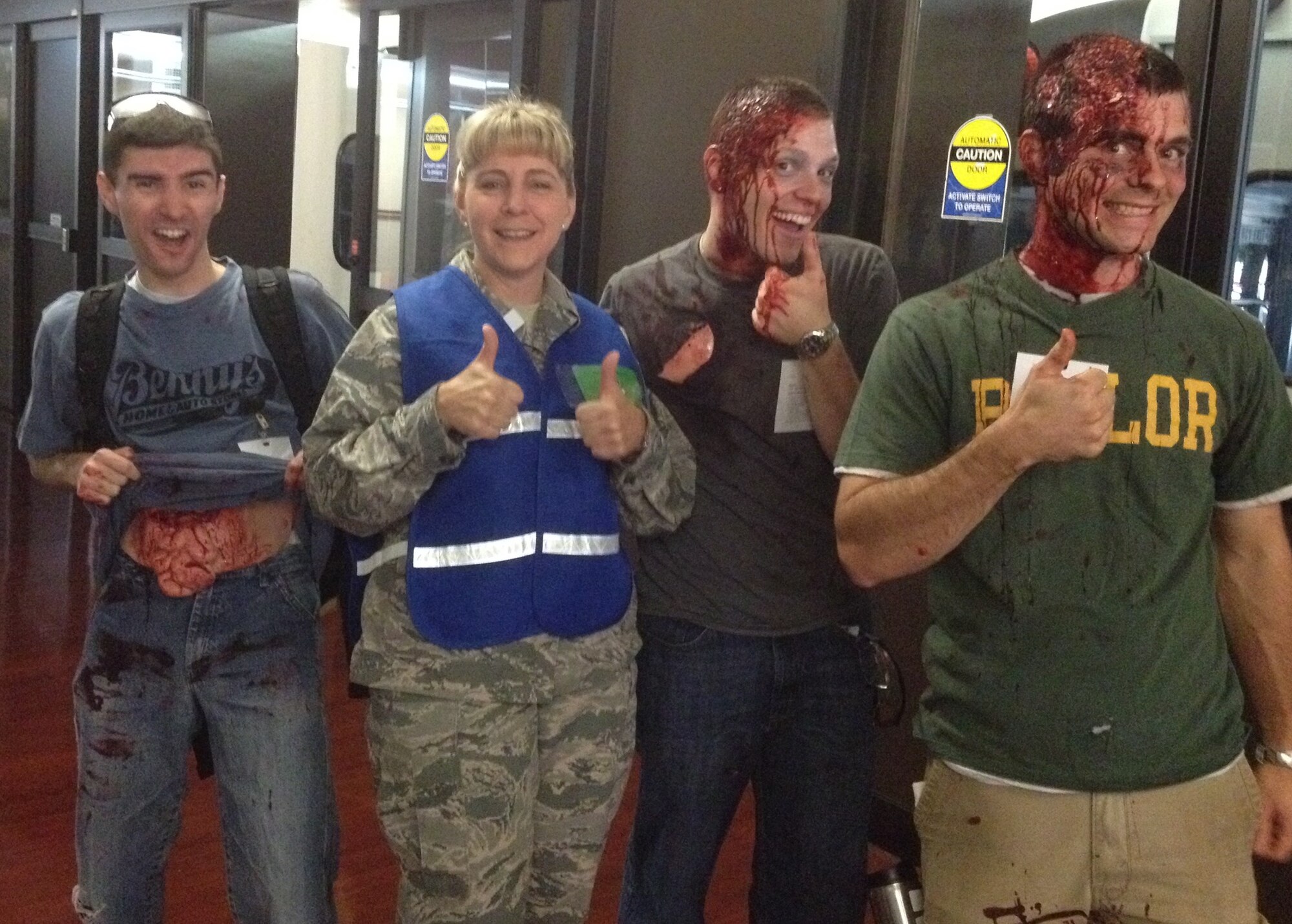 EXERCISE EXERCISE EXERCISE   No one is really hurt. The 79th Medical Wing Moulage team did a great job on the volunteers to make it look like they were injured. They are all smiles as they prepare to be bused to the location. More photos coming later today. EXERCISE EXERCISE EXERCISE