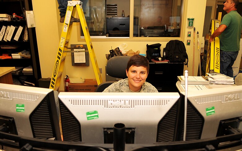 Senior Airman Kelsey Owens, 319th Security Forces Squadron Base Defense Operations Center controller, maintains records of security measures taken throughout the day and dispatches forces to incidents when necessary on Grand Forks Air Force Base, North Dakota, Aug. 10, 2015. Owens was selected as Warrior of the Week for the second week of August. (U.S. Air Force photo by Airman 1st Class Bonnie Grantham/Released)