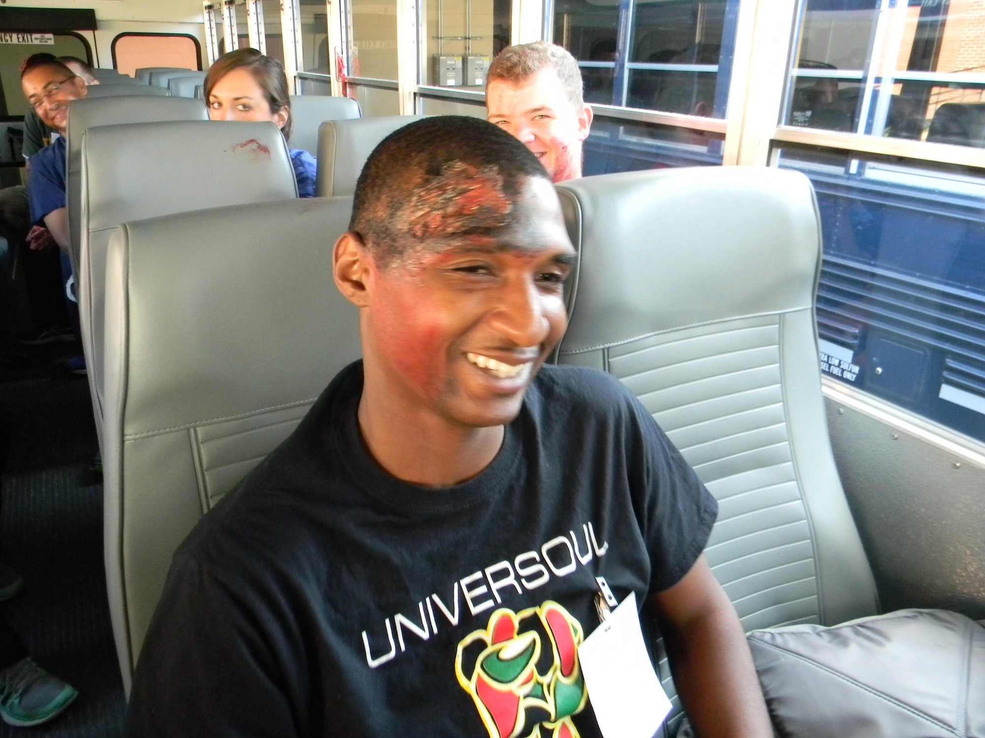 EXERCISE EXERCISE EXERCISE   No one is really hurt. The 79th Medical Wing Moulage team did a great job on the volunteers to make it look like they were injured. They are all smiles as they prepare to be bused to the location. More photos coming later today. EXERCISE EXERCISE EXERCISE