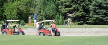 Participants tee off at the semiannual Military Affairs Committee golf scramble Aug. 10, 2015, in Grand Forks, North Dakota. The event, hosted by the Grand Forks Chamber of Commerce Military Affairs Committee, alternates tournament locations on and off Grand Forks Air Force Base twice a year. (U.S. Air Force photo by Senior Airman Desiree Economides/Released)