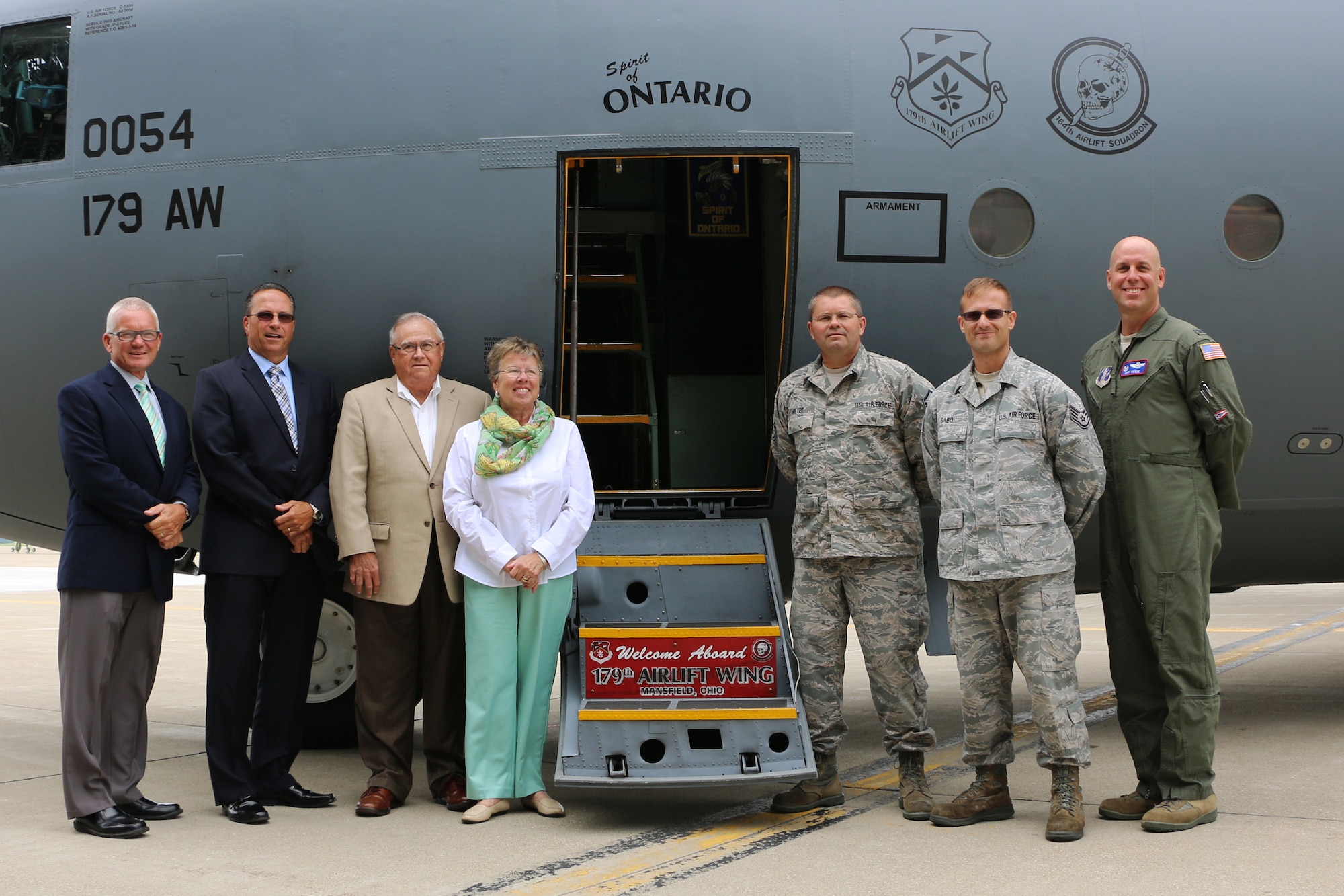 City of Ontario local leaders gather with members of the 179th Airlift Wing, Mansfield, Ohio, for the dedication of one of their C-130H Hercules, the "Spirit of Ontario", Aug. 6, 2015. This aircraft is one  of eight C-130H's that have been assigned to the Ohio Air National Guard unit. Each of the eight aircraft are being dedicated to supportive local communities.  Special guests included Ontario Mayor Randy E. Hutchinson, Service Safety Director Jeff Wilson, Ontario Council President Larry Collins and his wife Beverly. (U.S. Air National Guard photo by Tech. Sgt. Joe Harwood\Released)