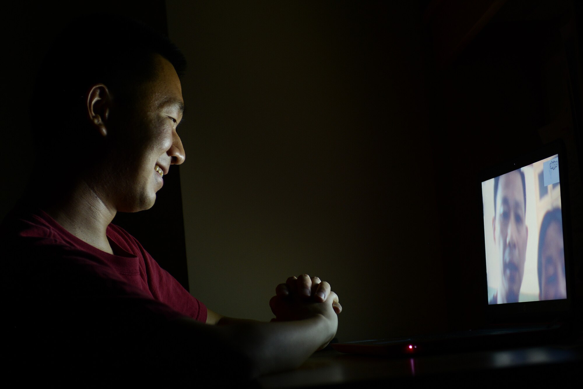 U.S. Air Force Airman 1st Class Bin Ma, 20th Comptroller Squadron financial services technician, speaks with his parents through a video chat in his dorm room at Shaw Air Force Base, S.C., Aug. 2, 2015. Ma is hoping to soon visit his parents in China who he hasn’t seen in seven years and is anticipating bringing them to America as U.S. citizens in a few years. (U.S. Air Force photo by Senior Airman Diana M. Cossaboom/Released)