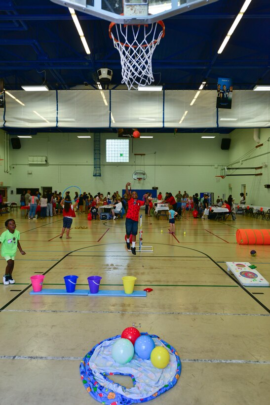Dominique Jones shoots a free throw during the Fort Eustis back-to-school block party at the Middle School and Teen Center at Fort Eustis, Va., Aug. 11, 2015. The party, which was open to all school-aged military families, aimed to prepare Joint Base Langley-Eustis community members for the upcoming school year. (U.S. Air Force photo by Staff Sgt. Natasha Stannard/Released)