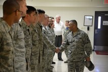 Chief Master Sgt. Gerardo Tapia, Air Education and Training Command command chief, is greeted by Airmen at the 47th Flying Training Wing Maintenance Directorate Egress shop on Laughlin Air Force Base, Texas, August 7, 2015. Tapia visited various Airmen around Laughlin after being invited to be the guest speaker for the 2015 Senior NCO Induction Ceremony.  (U.S. Air Force photo by Airman 1st Class Brandon May)(Released) 