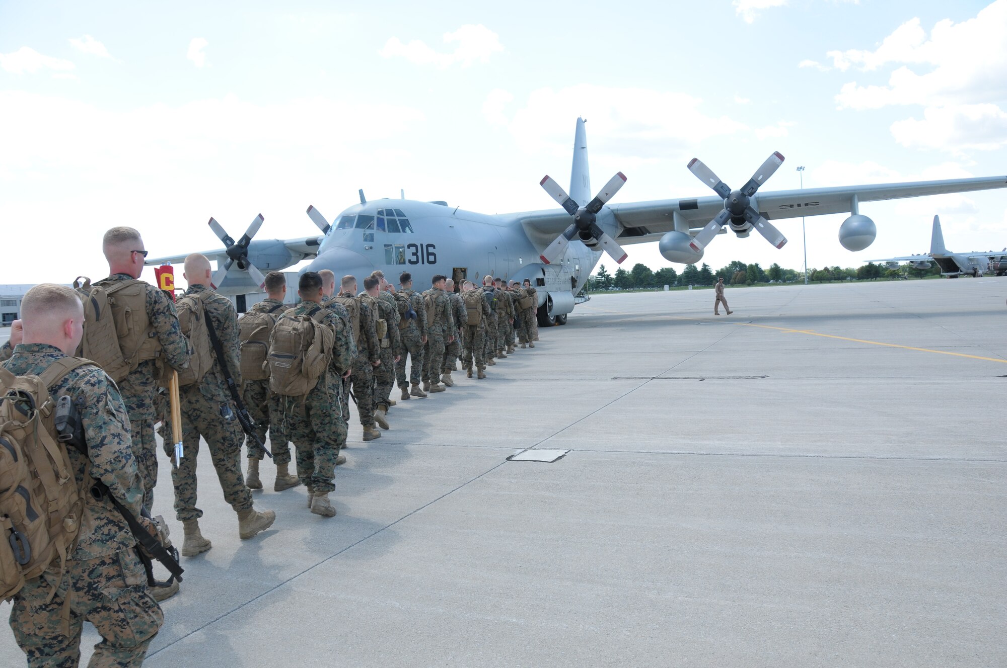 Marines from the 1st Battalion 24th Marines prepare to depart their home station of Selfridge Air National Guard Base, Mich., on Aug. 4, 2015. The Marines participated in a training exercise at the USMC Mountain Warfare Training Center in southern California. Nearly 300 Marines departed Selfridge for the training, moving on six USMC C-130 Hercules tactical airlift aircraft. The Michigan Air National Guard’s Small Air Terminal flight at Selfridge helped to facilitate the move, loading 10 pallets of equipment for transport on the C-130s for the Marines. Many Michigan-based military units utilize the capabilities of the Small Air Terminal facility at Selfridge to facilitate major troop and equipment movement. (U.S. Air National Guard photos by Master Sgt. David Kujawa and Staff Sgt. Samara Taylor / Released)