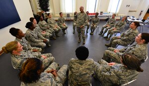 U.S. Air Force Master Sgt. Freda Allen, 633rd Logistics Readiness Squadron noncommissioned officer in charge of individual protective equipment, participates in an ice breaker game during the Women Warrior Luncheon at Langley Air Force Base, Va., Aug. 12, 2015. The game allowed the women to get to know a little about the diversity of each person’s upbringing. (U.S. Air Force photo by Senior Airman Aubrey White/Released)
