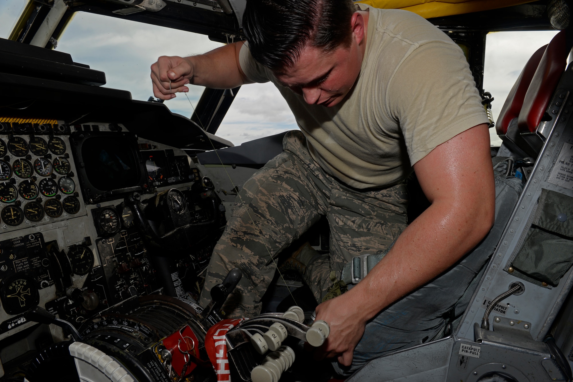 Senior Airman Tyler Shepherd, 20th Expeditionary Bomb Squadron aircrew flight equipment specialist, tightens up the stitching of a parachute flashlight pocket Aug. 12, 2015, at Andersen Air Force Base, Guam. AFE specialists repair and maintain vital life support equipment for aviators. (U.S. Air Force photo by Staff Sgt. Alexander W. Riedel/Released)