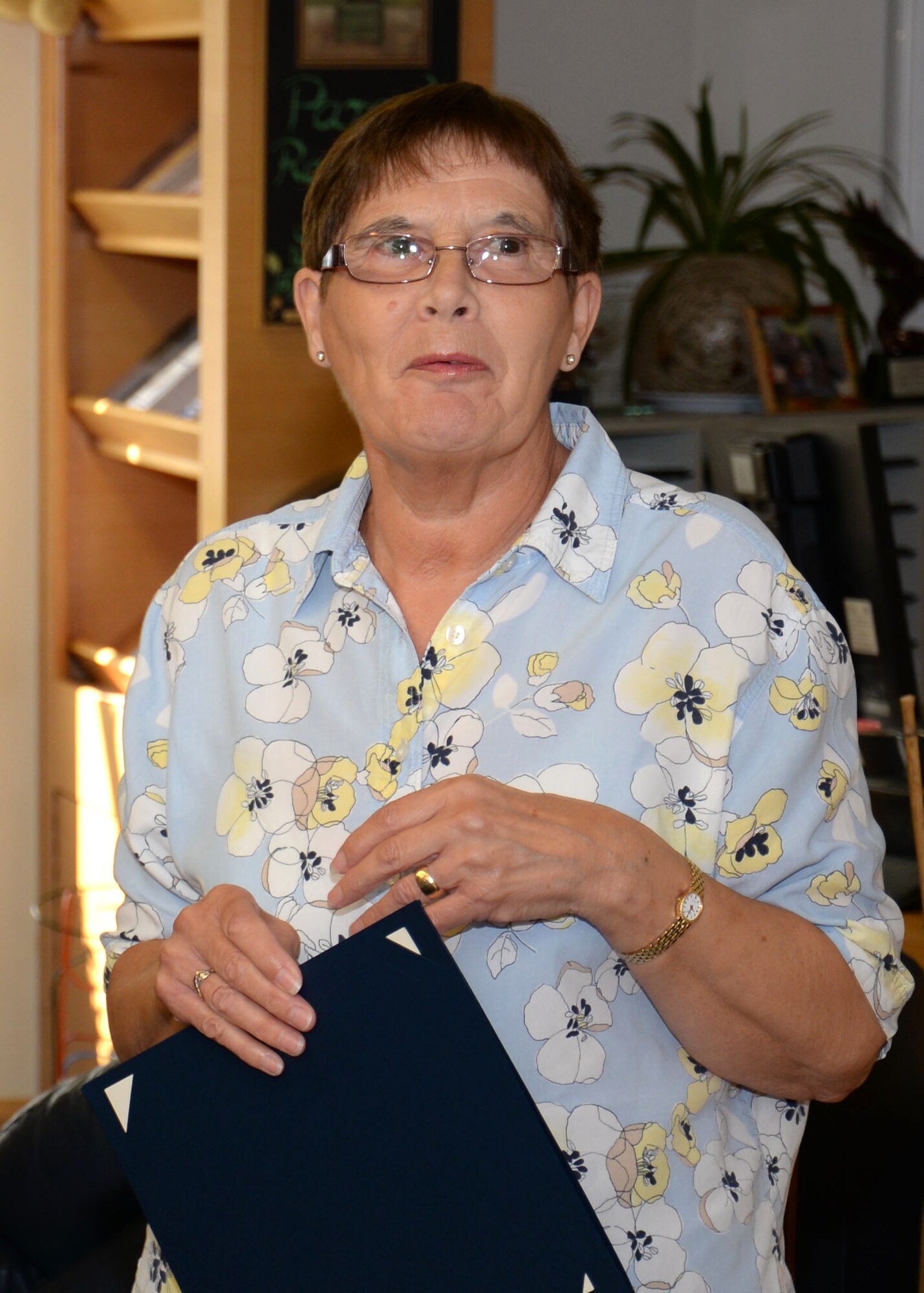 Maureen Morley, 100th Force Support Squadron Child Development Center room leader from Beck Row, Suffolk, speaks following a presentation of a pin and certificate to commemorate her 30 years of service to the U.S. Air Force July 29, 2015, at the CDC on RAF Mildenhall, England. Morley plans to travel, renovate her home, visit old friends and take the time to read and exercise following her retirement. (U.S. Air Force photo by Gina Randall/Released)