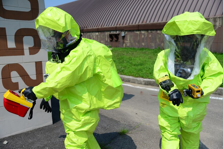 Senior Airman Timothy Burnett, 51st Medical Group Aerospace Medicine Squadron bioenvironmental engineering journeyman and Airman 1st Class Benjamin Thompson, 51st Civil Engineer Squadron emergency management apprentice use equipment that allows them to identify simulated radioactive isotopes and take airborne readings to assess danger levels during an exercise at Osan Air Base, Republic of Korea, Aug 4, 2015. The scenario is part of a week-long series of intense, integrated base emergency response capability training exercises for initial and follow-on responders.
(U.S. Air Force photo/Staff Sgt. Amber Grimm)