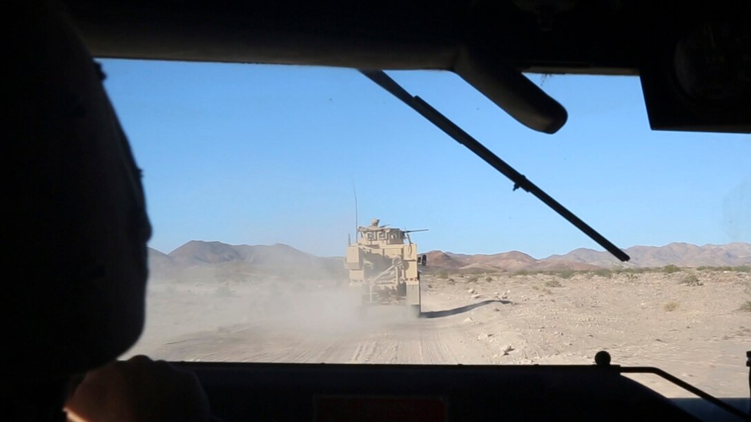 Marines with Combat Logistics Battalion 1, Combat Logistics Regiment 1, 1st Marine Logistics Group, convoy during a mounted patrol exercise at Marine Corps Air Ground Combat Center Twentynine Palms, California, Aug. 10, 2015. Marines faced a simulated threat of ambush and improvised explosive device attacks throughout the training exercise.