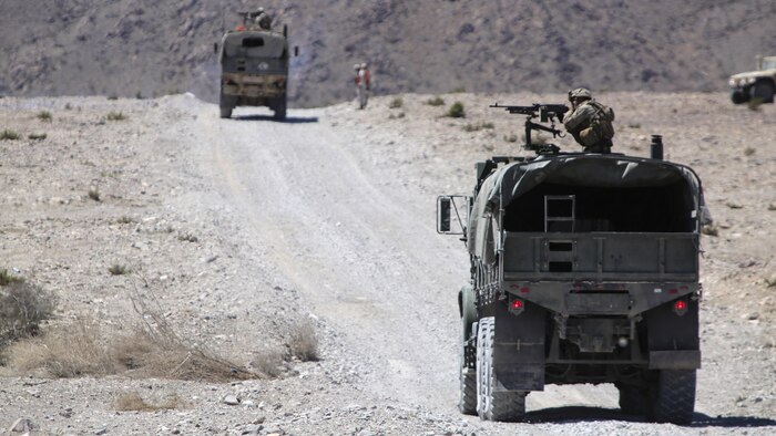 Marines with Combat Logistics Battalion 1, Combat Logistics Regiment 1, 1st Marine Logistics Group, fire on targets with M240 medium machine guns during a mounted patrol exercise at Marine Corps Air Ground Combat Center Twentynine Palms, California, Aug. 10, 2015. Marines faced numerous challenges during the training including simulated ambushes, improvised explosive device attacks and casualty evacuations.