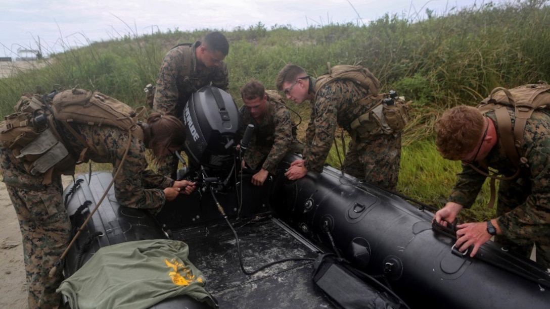 Marines with 2nd Radio Battalion prepare a Zodiac CRRC shortly before beginning amphibious operations at Marine Corps Base Camp Lejeune, North Carolina, Aug. 10, 2015. The amphibious operations were part of a two-week radio reconnaissance operator’s course. The unit holds the course in order to ready its radio operators for real world operations.
