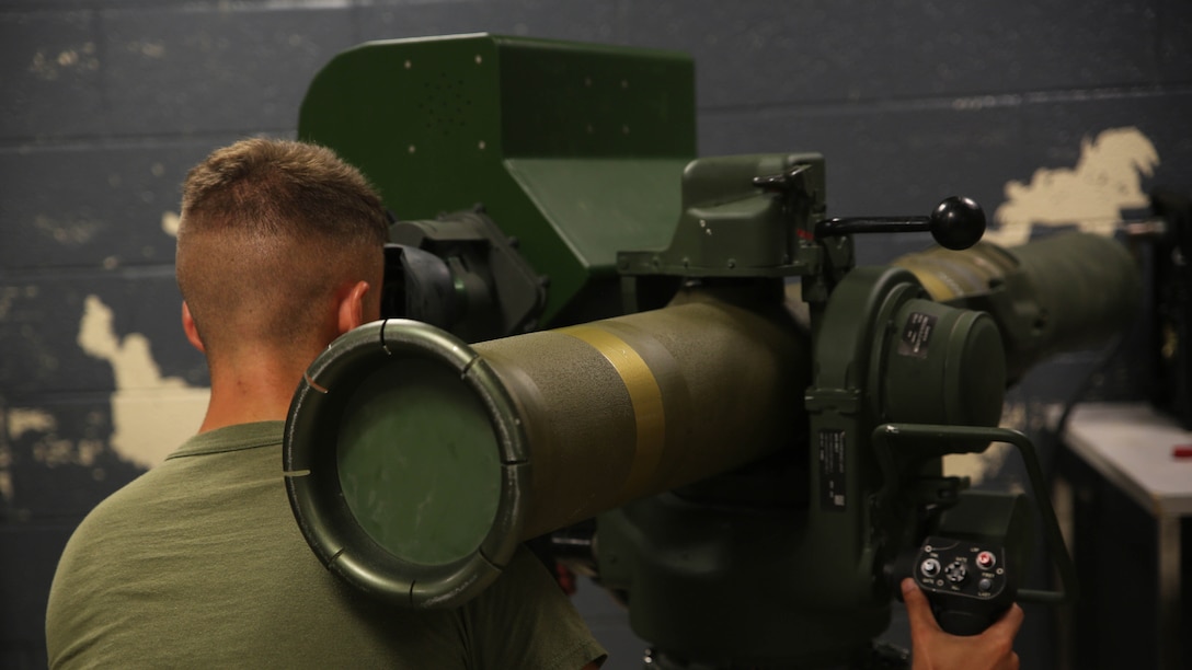Lance Cpl. Justin Vestal, an anti-tank missile man with Combined Anti-Armor Team Platoon, Weapons Company, 2nd Battalion, 2nd Marine Regiment, operates a simulated M41A4 Saber missile system during a simulated anti-armor exercise at Camp Lejeune, N.C., Aug. 8, 2015. The simulation allowed a variety of combat scenarios with the system, much like the indoor simulated marksmanship trainer. 