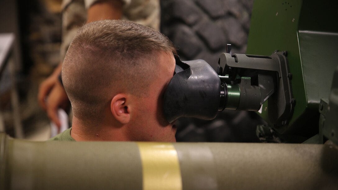Lance Cpl. Justin Vestal, an anti-tank missile man with Combined Anti-Armor Team Platoon, Weapons Company, 2nd Battalion, 2nd Marine Regiment, operates a simulated M41A4 Saber missile system during a simulated anti-armor exercise at Camp Lejeune, N.C., Aug. 8, 2015. The simulation allowed a variety of combat scenarios with the system, much like the indoor simulated marksmanship trainer. 