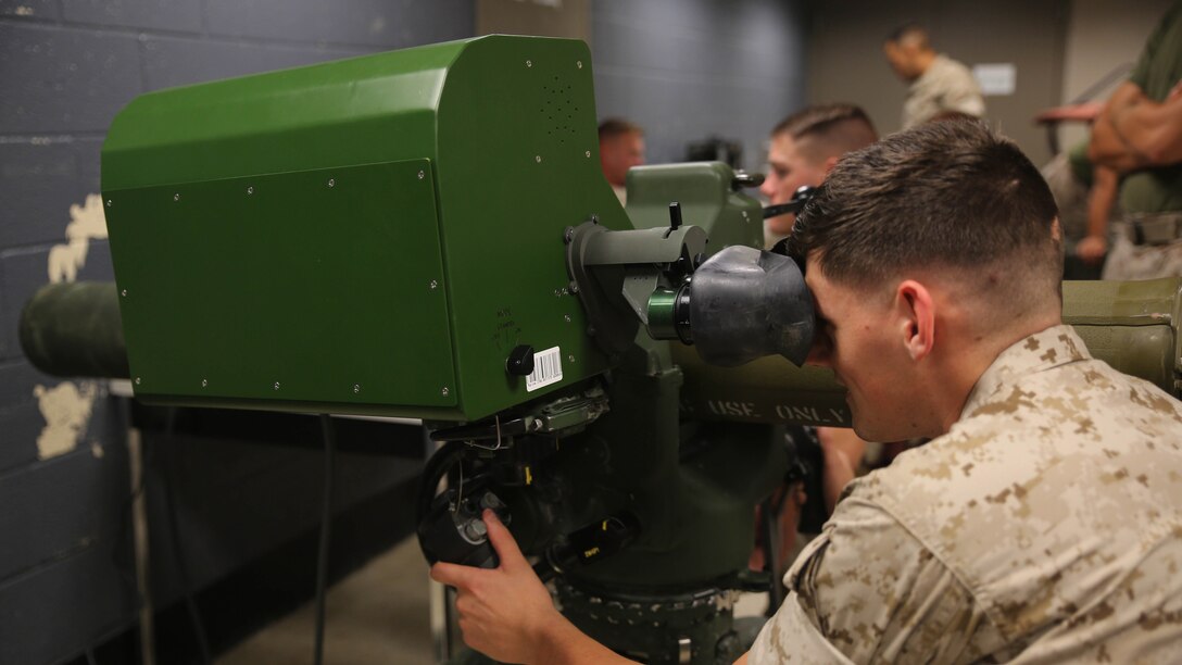 Sgt. Dwight Harris, an anti-tank missile man with Combined Anti-Armor Team Platoon, Weapons Company, 2nd Battalion, 2nd Marine Regiment, operates a simulated M41A4 Saber missile system during a simulated anti-armor exercise at Camp Lejeune, N.C., Aug. 8, 2015. The simulated Saber challenged Marines with its inclusion of friendly and enemy targets, testing their judgement before firing. 