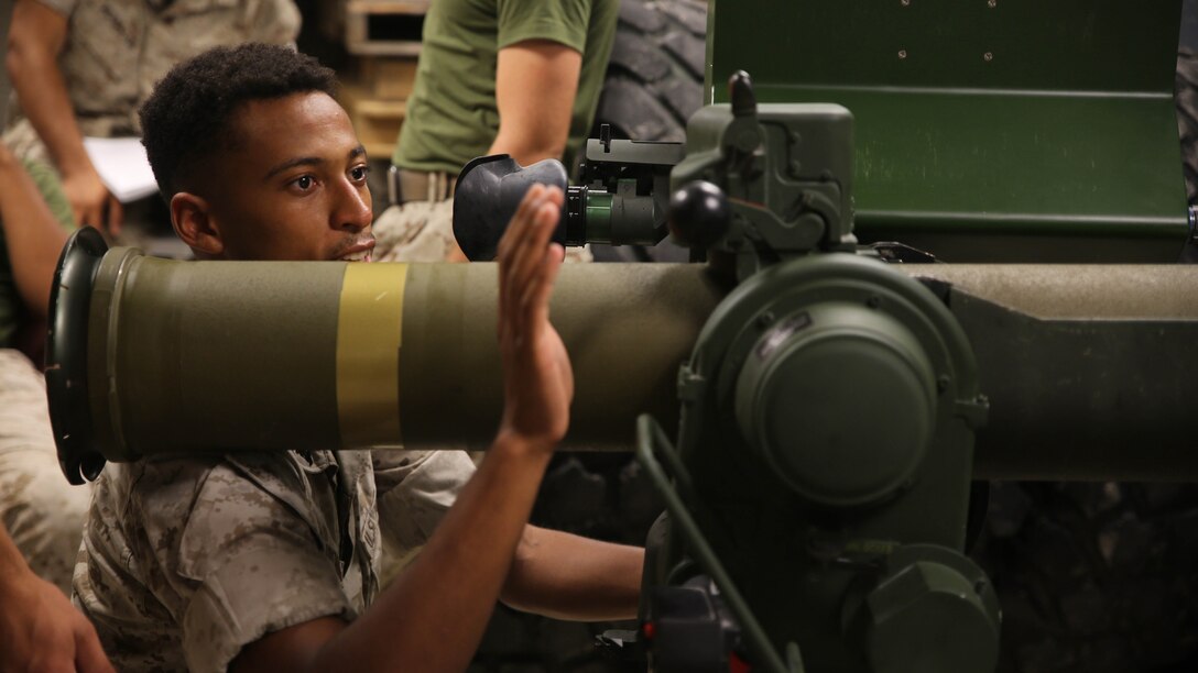 Lance Cpl. Morgan Canady-Town, a machine gunner with Combined Anti-Armor Team Platoon, Weapons Company, 2nd Battalion, 2nd Marine Regiment, operates a simulated M41A4 Saber missile system during a simulated anti-armor exercise at Camp Lejeune, N.C., August 8, 2015. For machine gunners, the exercise served as cross-training to familiarize non-missile men with missile systems. 