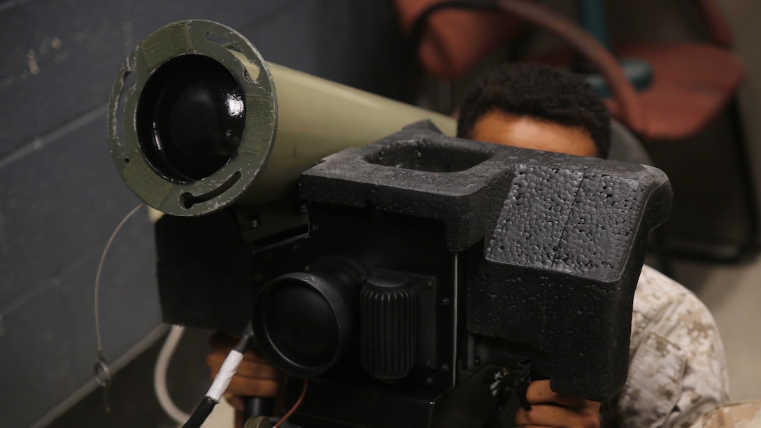 Lance Cpl. Morgan Canady-Town, a machine gunner with Combined Anti-Armor Team Platoon, Weapons Company, 2nd Battalion, 2nd Marine Regiment, operates a simulated FGM-148 Javelin during a simulated anti-armor exercise at Camp Lejeune, N.C., August 8, 2015. For machine gunners, the exercise served as cross-training to familiarize non-missile men with missile systems. 