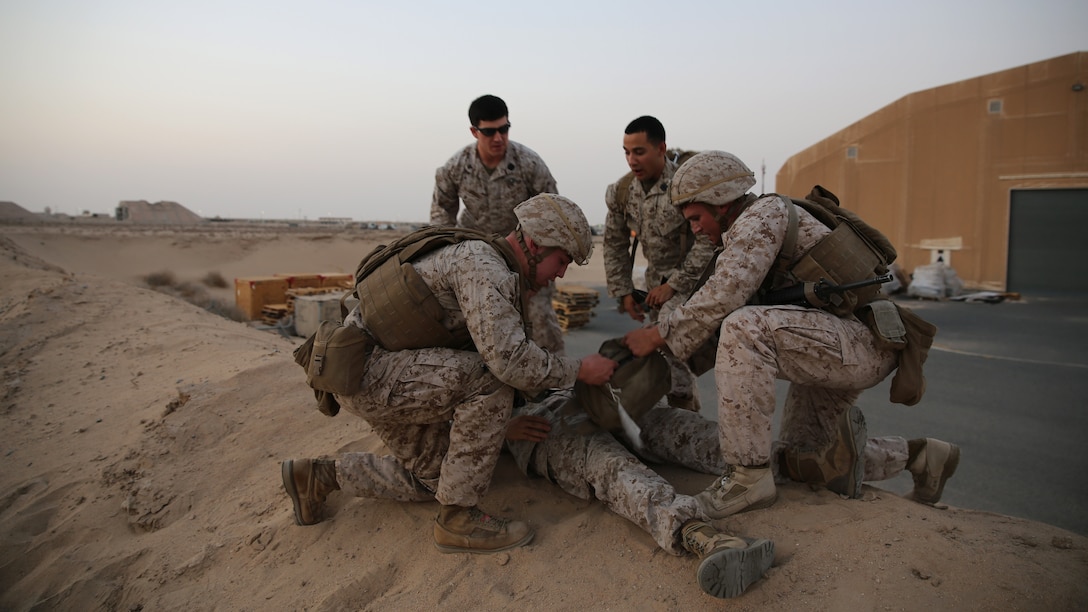 U.S. Marine Lance Cpl. Fred Hass from Keene, New Hampshire and Lance Cpl. Clinton Turman from Tyler, Texas, both with the Ground Combat Element, Special Purpose Marine Air-Ground Task Force-Crisis Response-Central Command, treat their patient during the final test of the Combat Life Saver course in Southwest Asia, Aug. 12, 2015. During the final test the students work in pairs and each pair is given a different scenario where they must assess, treat and pass along a patient to a follow-on medical provider. The SPMAGTF corpsmen provide a three-day CLS course teaching combat triage and emergency trauma care to improve the survivability of the Crisis Response Company and coalition partners.