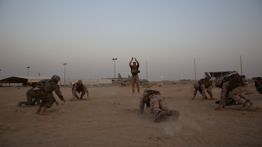 Navy corpsmen with the Ground Combat Element, Special Purpose Marine Air-Ground Task Force-Crisis Response-Central Command put Airmen and Marines through a strenuous workout before leading them into their final evaluation during a Combat Life Saver course in Southwest Asia, Aug. 12, 2015. During the final test the students work in pairs and each pair is given a different scenario where they must assess, treat and pass along a patient to a follow-on medical provider. The SPMAGTF corpsmen provide a three-day CLS course teaching combat triage and emergency trauma care to improve the survivability of the Crisis Response Company and coalition partners.