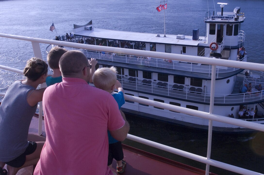 A family watches the Southern Belle pass by from their vantage point on the Motor Vessel Mississippi during a public tour of the vessel docked at Ross's Landing in Chattanooga, Tenn., Aug. 7, 2015. The M/V Mississippi spends more than 90 percent of its time as a working towboat, moving barges, equipment and supplies on the lower Mississippi River.  The M/V Mississippi, built in 1993 by Halter Marine, is the fifth Army Corps of Engineers towboat to bear the name.  It is the largest diesel towboat in the United States at 241-feet long, 58-feet wide and five stories high.  Three 2,100-horsepower diesel engines power the vessel.