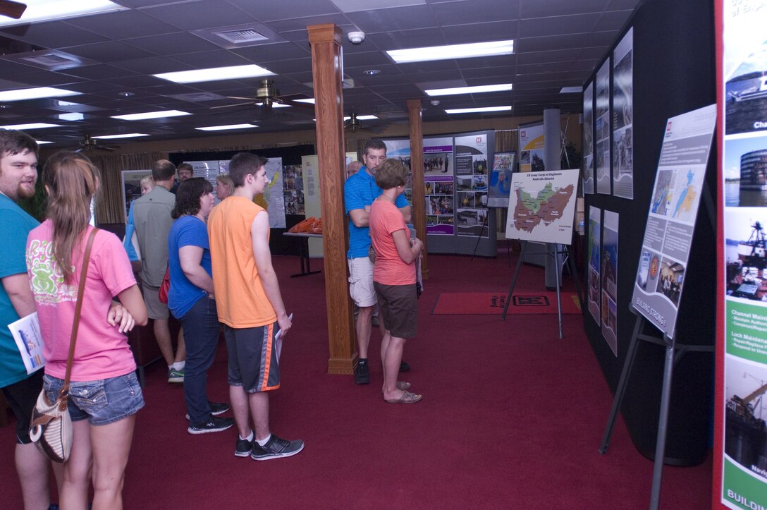 Visitors look at displays about the U.S. Army Corps of Engineers Nashville District, Great Lakes and Ohio River Division, and Tennessee Valley Authority onboard the Motor Vessel Mississippi during a public tour of the vessel docked at Ross's Landing in Chattanooga, Tenn., Aug. 7, 2015. The M/V Mississippi spends more than 90 percent of its time as a working towboat, moving barges, equipment and supplies on the lower Mississippi River.  The M/V Mississippi, built in 1993 by Halter Marine, is the fifth Army Corps of Engineers towboat to bear the name.  It is the largest diesel towboat in the United States at 241-feet long, 58-feet wide and five stories high.  Three 2,100-horsepower diesel engines power the vessel. 