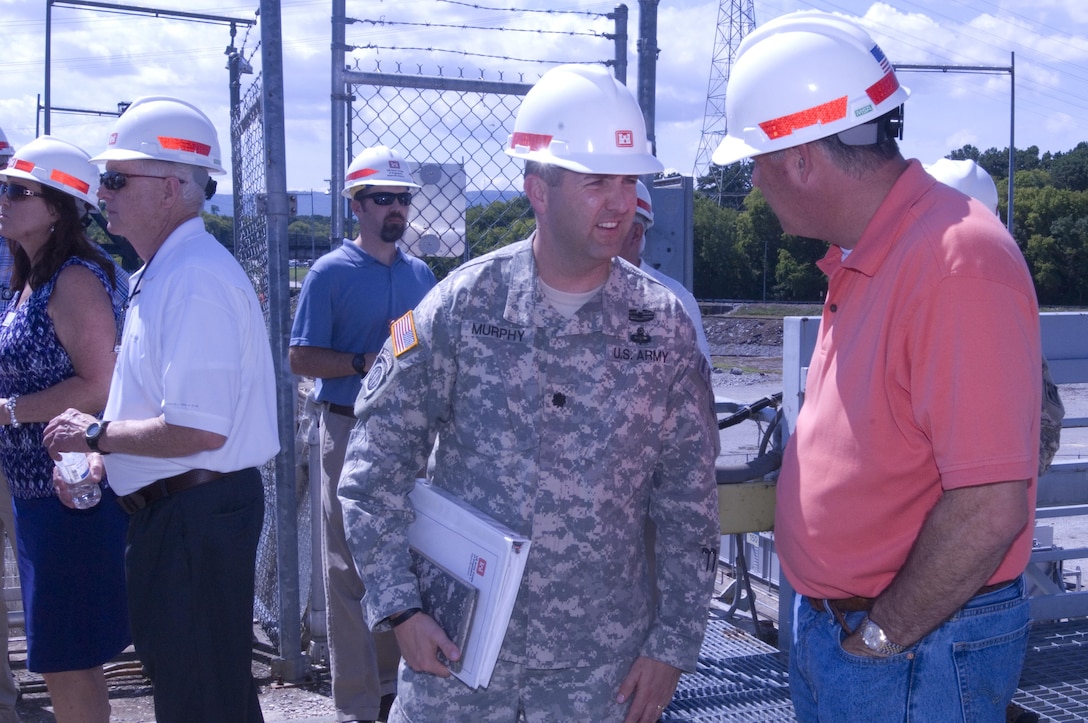 Lt. Col. Stephen F. Murphy, U.S. Army Corps of Engineers Nashville District commander, talks with stakeholders while the Mississippi River Commission visits Chickamauga Lock on the Tennessee River in Chattanooga, Tenn., Aug. 8, 2015.