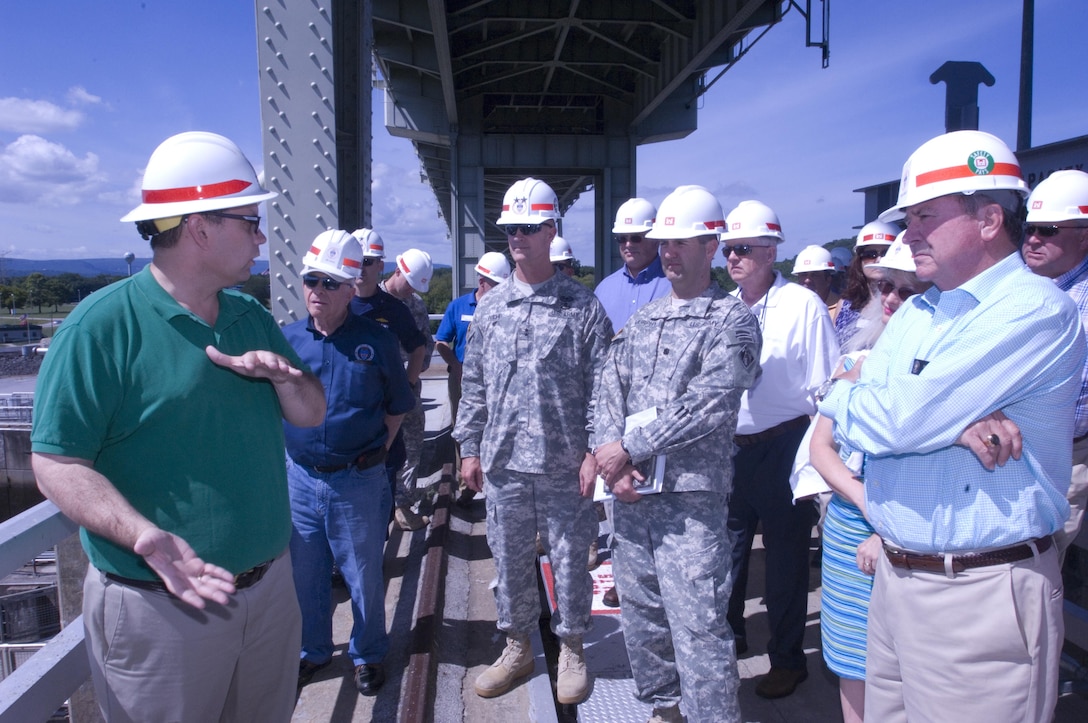 Tommy Long (Green Shirt), resident engineer for the Chickamauga Lock Replacement Project, briefs the Mississippi River Commission at the lock Aug. 8, 2015.  The commission is on a low water inspection of the Tennessee River. Long works in the U.S. Army Corps of Engineers Nashville District Engineering and Construction Division. 