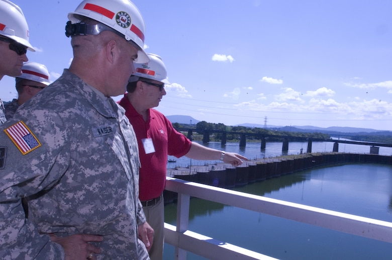 Don Getty (Red Shirt), project manager for the Chickamauga Lock Replacement Project, briefs Brig. Gen. Richard G. Kaiser, U.S. Army Corps of Engineers Great Lakes and Ohio River Division commander, during a visit to the lock Aug. 8, 2015 in his capacity as a member of the Mississippi River Commission.  The commission is on a low water inspection of the Tennessee River. Getty works in the U.S. Army Corps of Engineers Nashville District Project Planning Branch. 