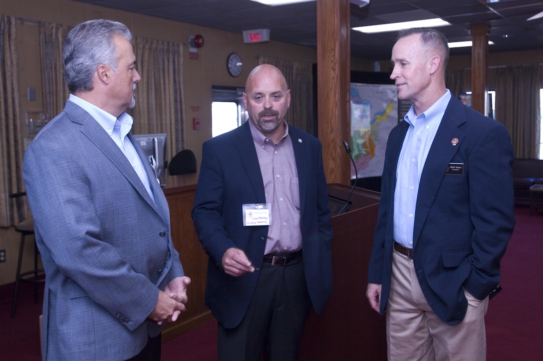 Maj. Gen. Michael C. Wehr (Right), Mississippi Valley Division commander and president of the Mississippi River Commission, speaks with David Bowlira (Center) and John McCormick of the Tennessee Valley Authority during a stakeholder social onboard the Motor Vessel Mississippi while docked at Ross’s Landing in Chattanooga, Tenn., Aug. 8, 2015. The commission is on a low water inspection of the Tennessee River and works to have a dialogue with community leaders along the waterway.
