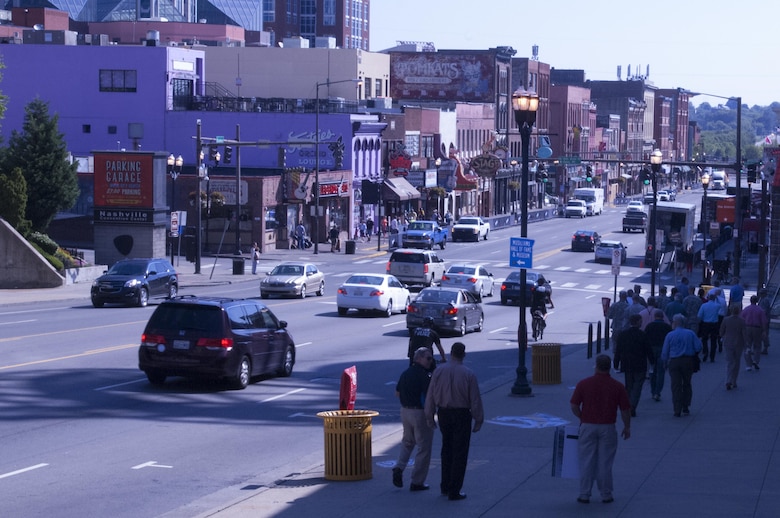 Several members of the Mississippi River Commission and local stakeholders head down lower Broadway in Nashville, Tenn. Aug. 12, 2015 during a walking tour.