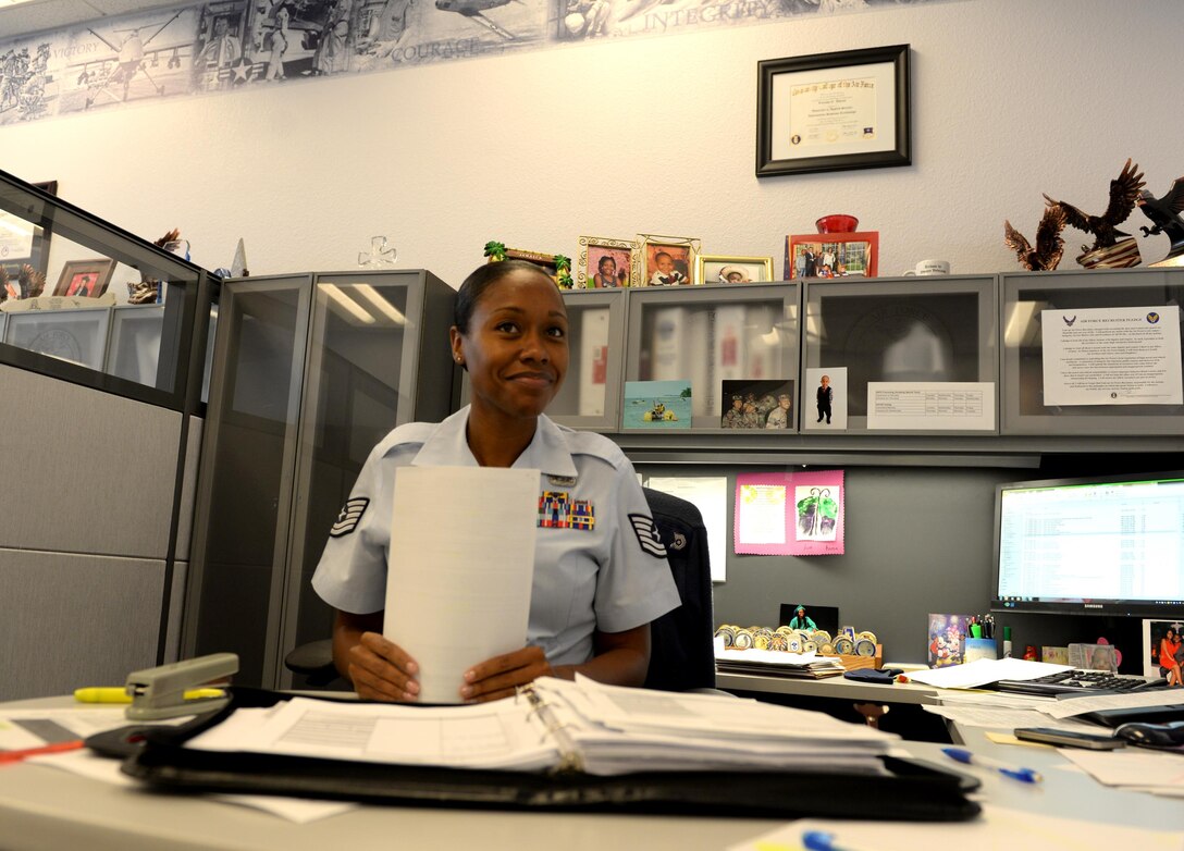 Tech. Sgt. Tanisha Ross, Enlisted Accessions Recruiter, 341st Recruiting Squadron, prepares for a meeting with Delayed Entry Program members in Live Oak, Texas, July 6, 2015. Before becoming a recruiter, Ross served as a Client Systems Technician. (U.S. Air Force photo by Tech. Sgt. Joshua Strang)